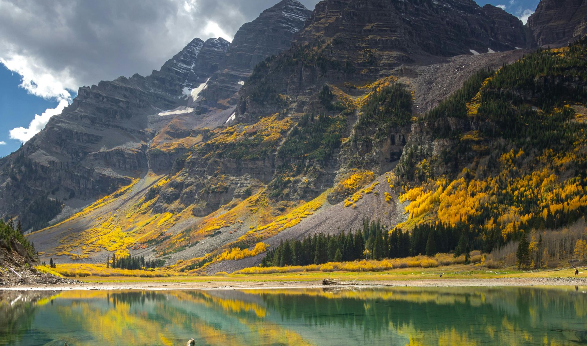 Luxury black Escalade limousine on a mountain road in Aspen, Colorado — Aspen Alpenglow Limousine private car service